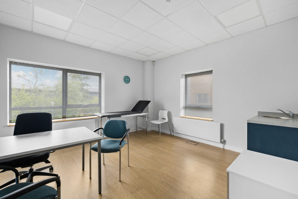 CQC-standard clinical room with an examination couch and sink